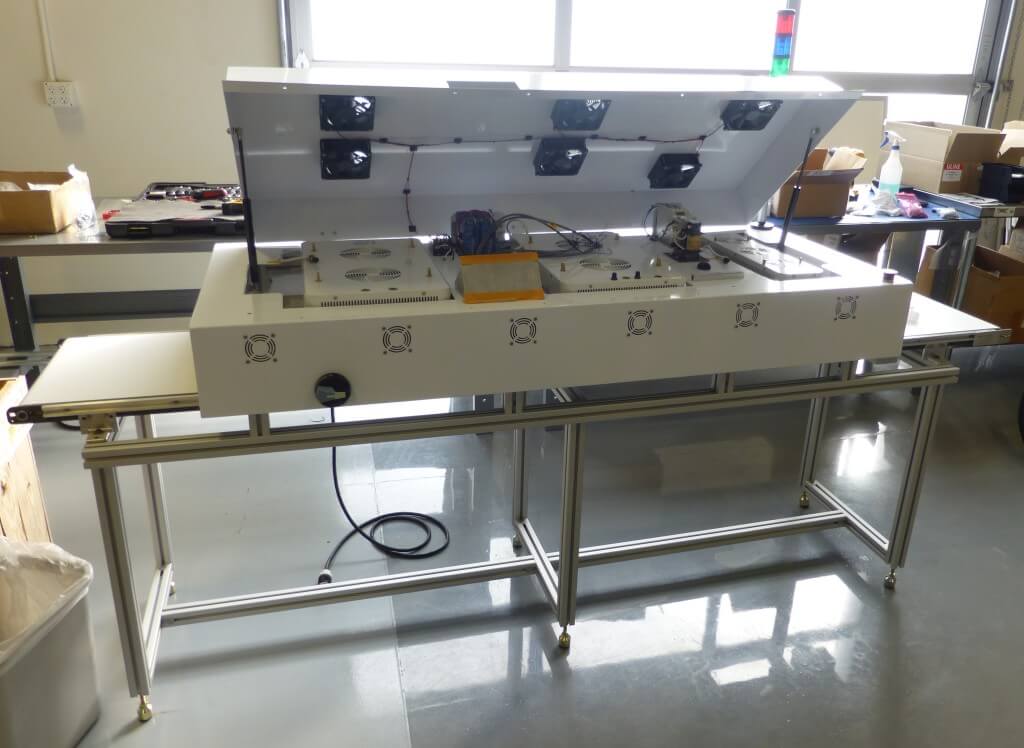 Curing On Display LCD Display's Curing System Uses LP Series Conveyor - Mini-Mover Conveyors