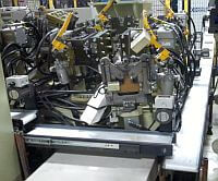 Mini-Mover Lite Series small conveyors used for parts and scrap removal between robotic cells